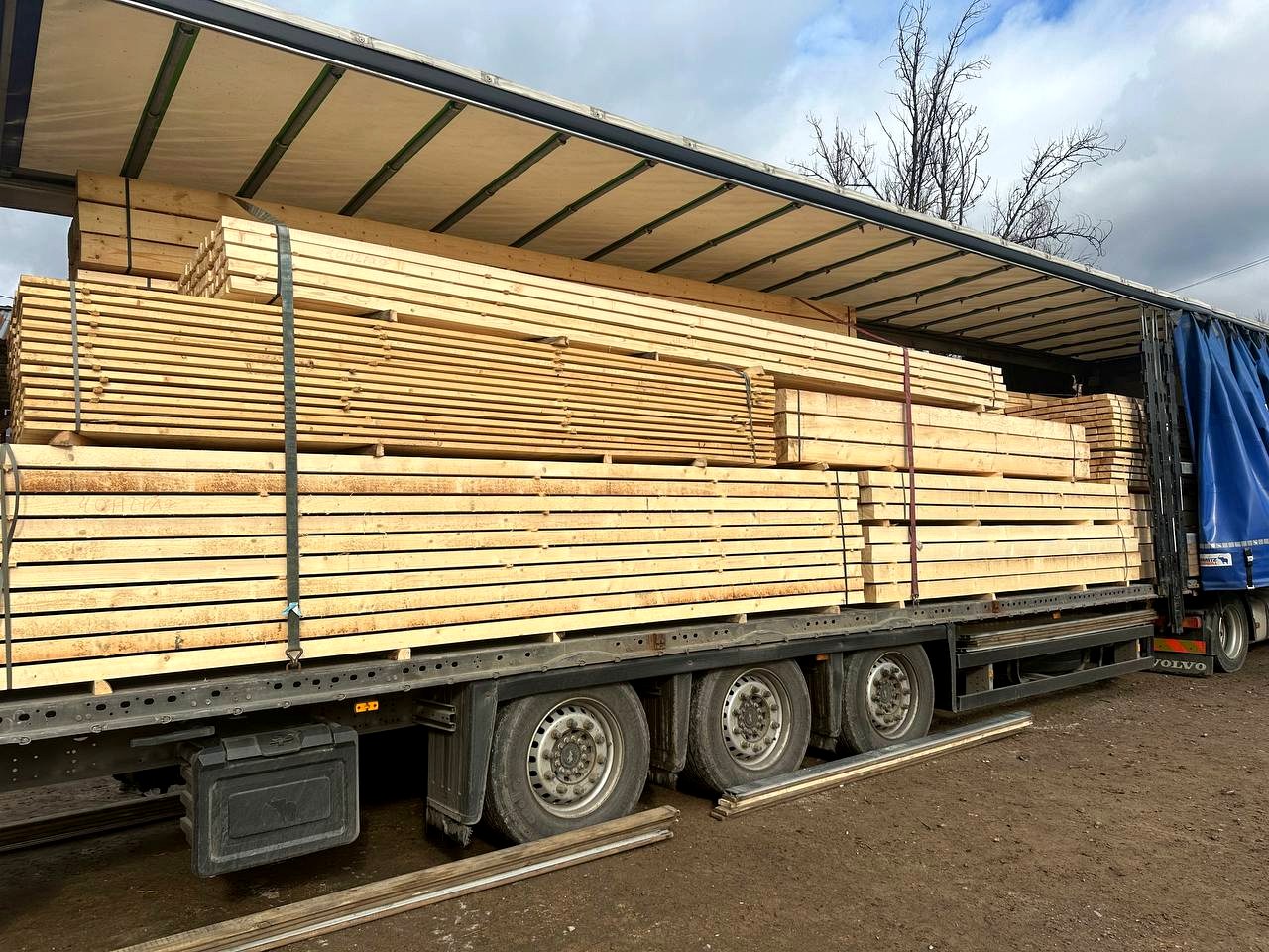 Truck with timber at TRAST-BUD production site