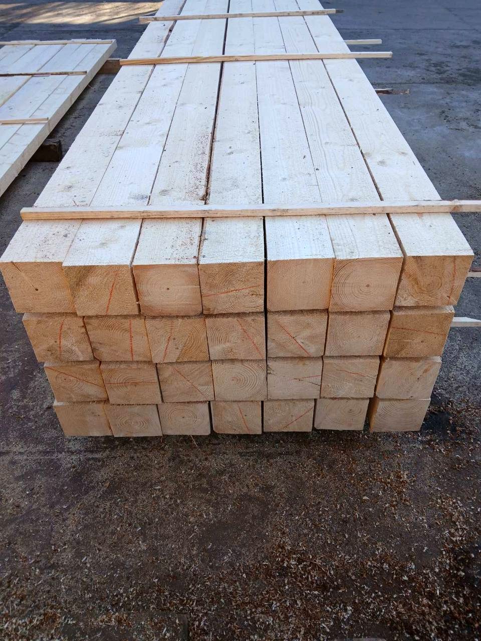 Stacked wooden beams ready for wholesale shipment